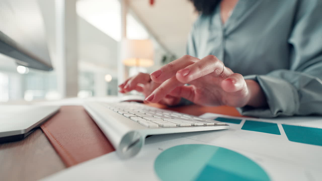 Hands Typing on Keyboard at Office