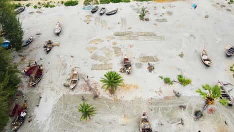 Fishing-Boats-And-Fisn-Nets-Lying-Over-Sandy-Shore-In-Bangladesh,-South-Asia