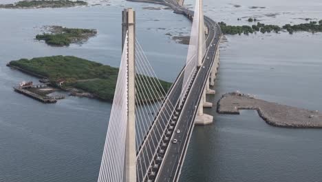 Cebu-Cordova-Link-Expressway,-pan-up-towards-Mactan,-aerial-shot