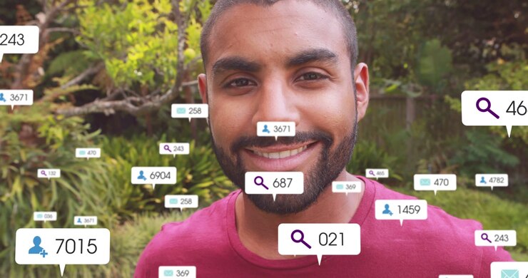 Man Smiling as Social Media Notifications Appear Around Him