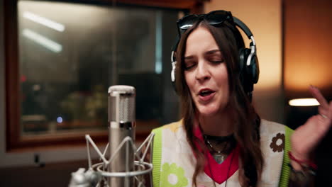 a singer recording in a studio