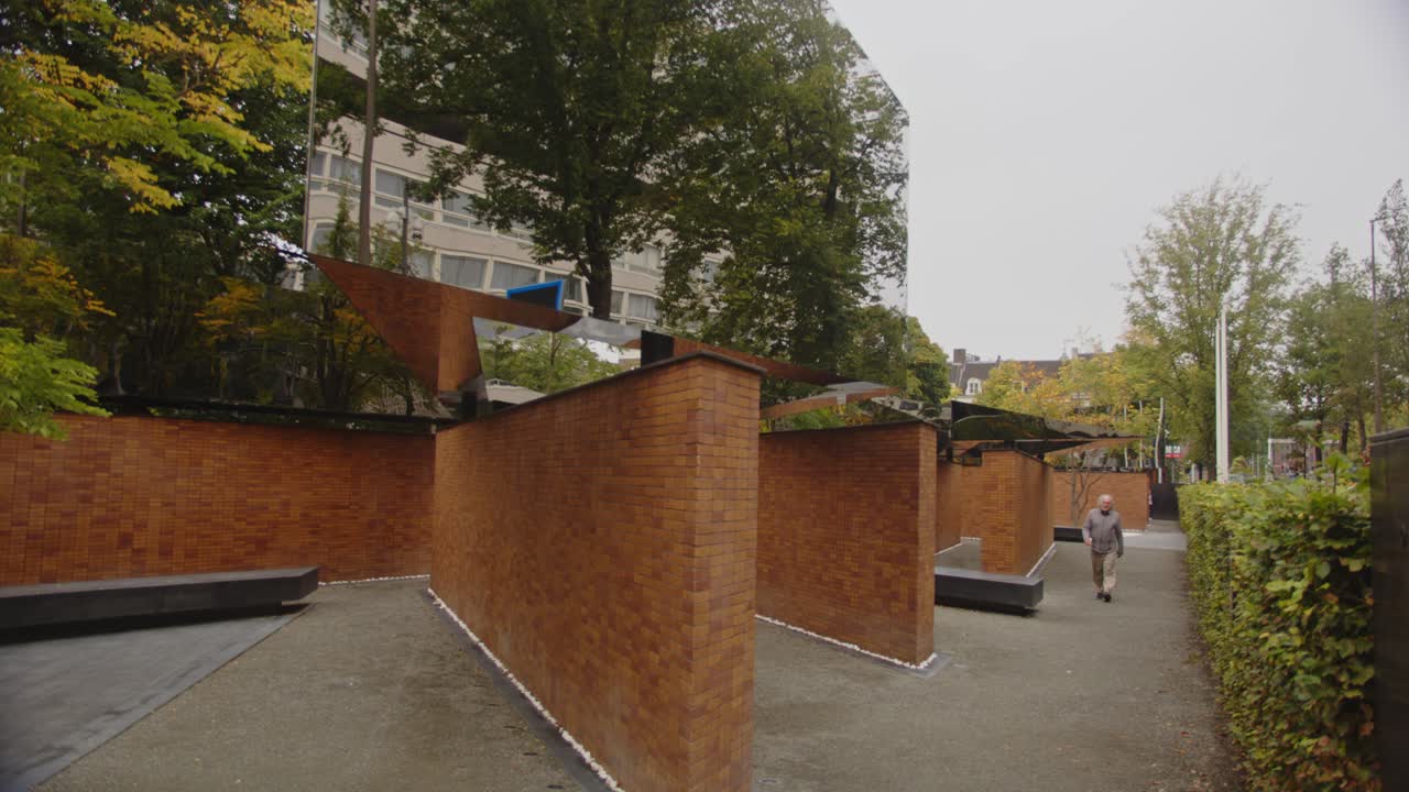 Tilt up to mirrors of National Holocaust Names Memorial in Amsterdam, the Netherlands