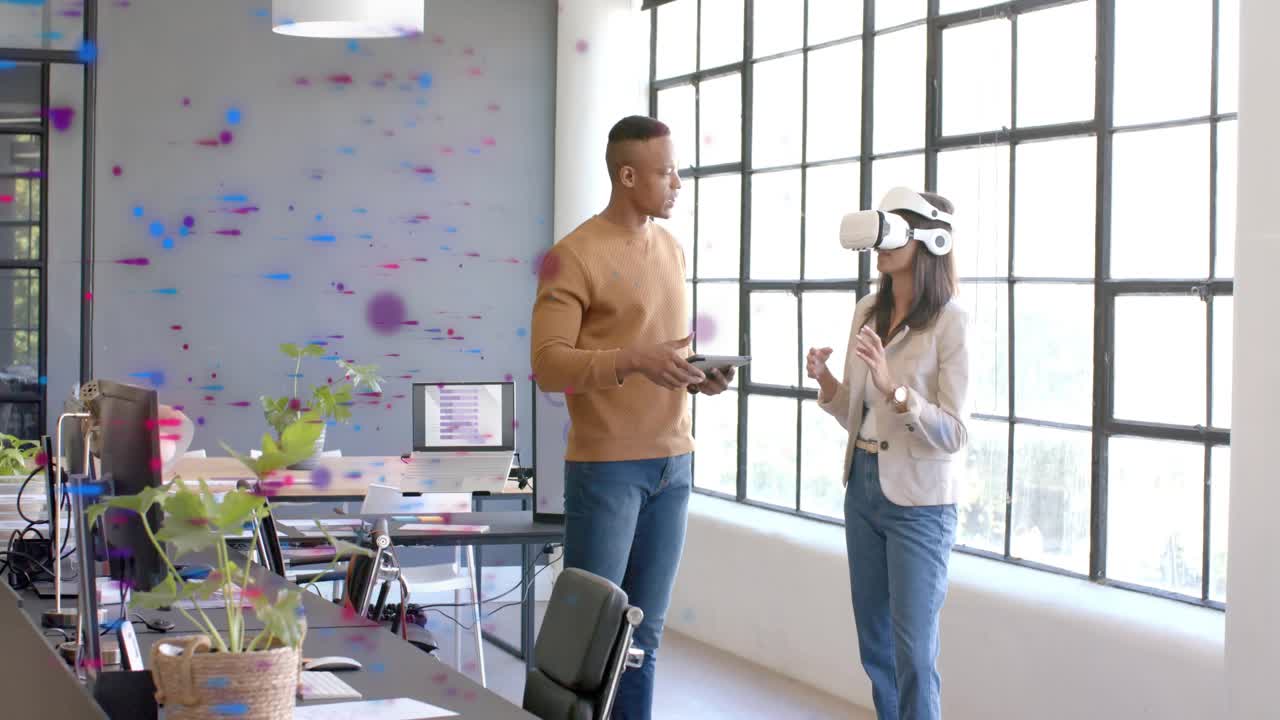 Man tapping tablet and guiding woman wearing VR headset, creating digital tech specks for training