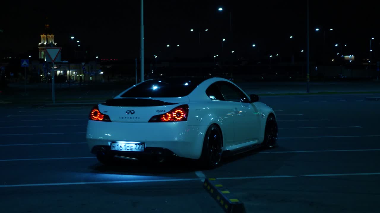 Car in Parking Lot at Night
