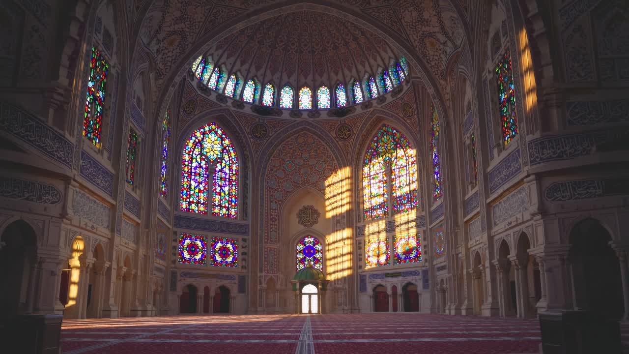 Sunlight streams through colorful stained glass windows illuminating the ornate interior of a mosque, creating a tranquil and spiritual atmosphere during morning prayers