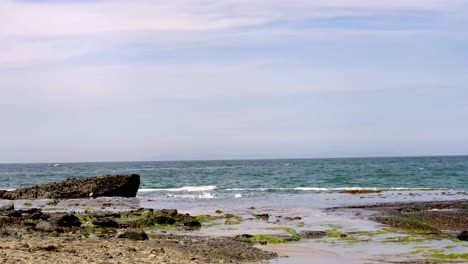 serene ocean waves crashing on rocky shore