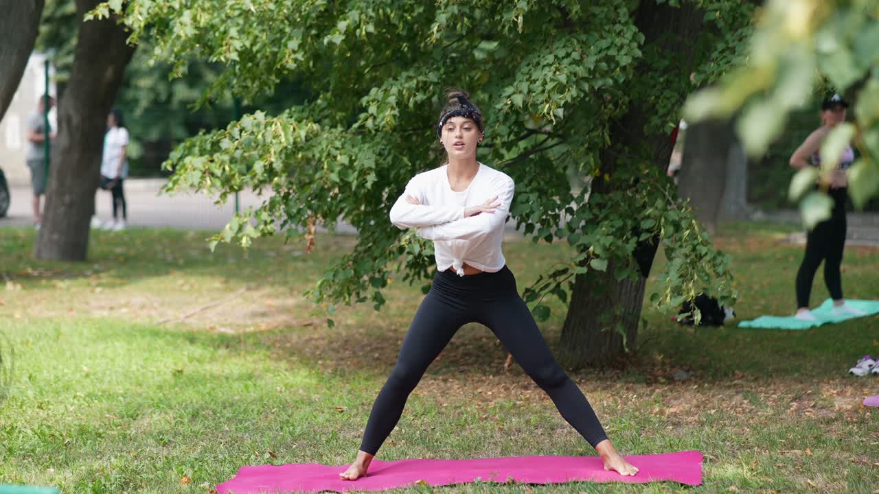 Women practicing yoga outdoors