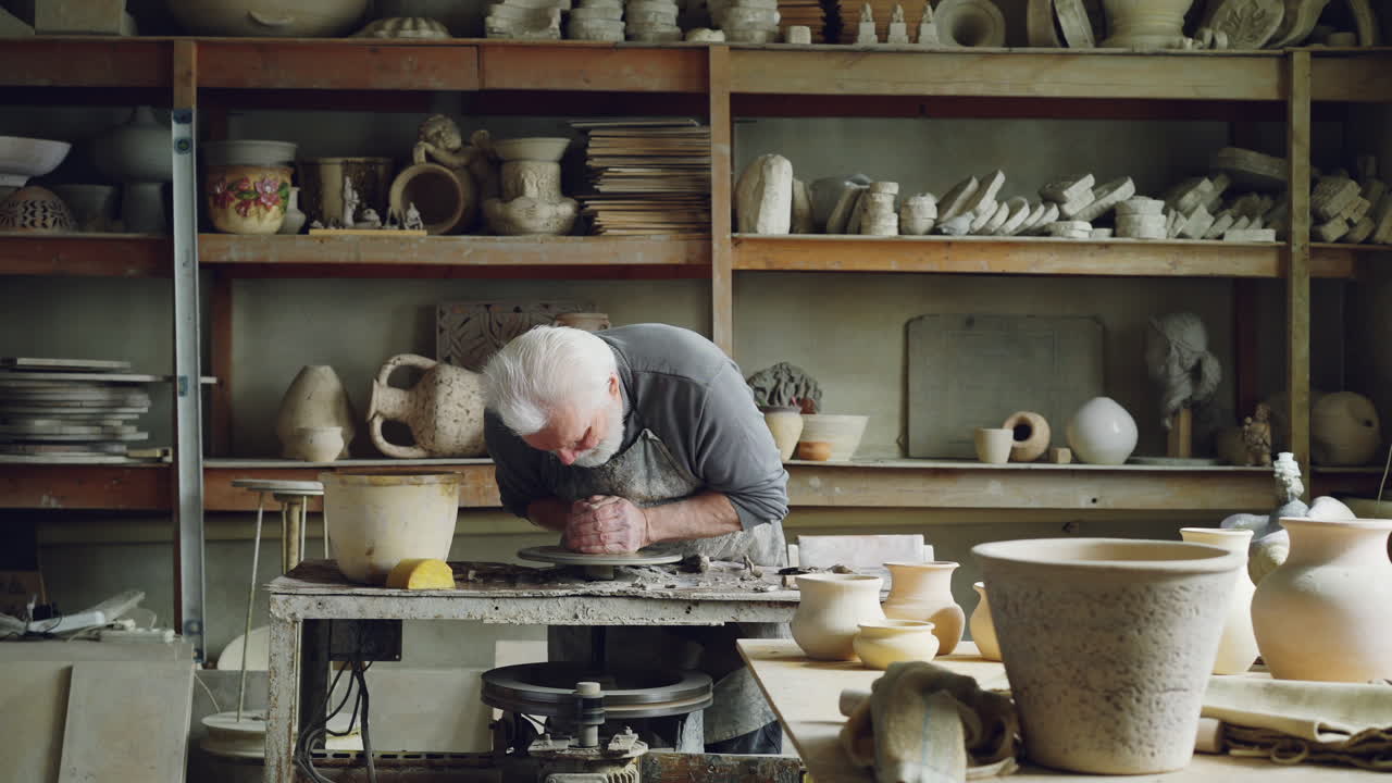 Senior Potter at Work in a Pottery Studio