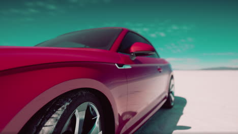 pink convertible car on salt flats