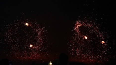 dazzling fire performance at night on the beach