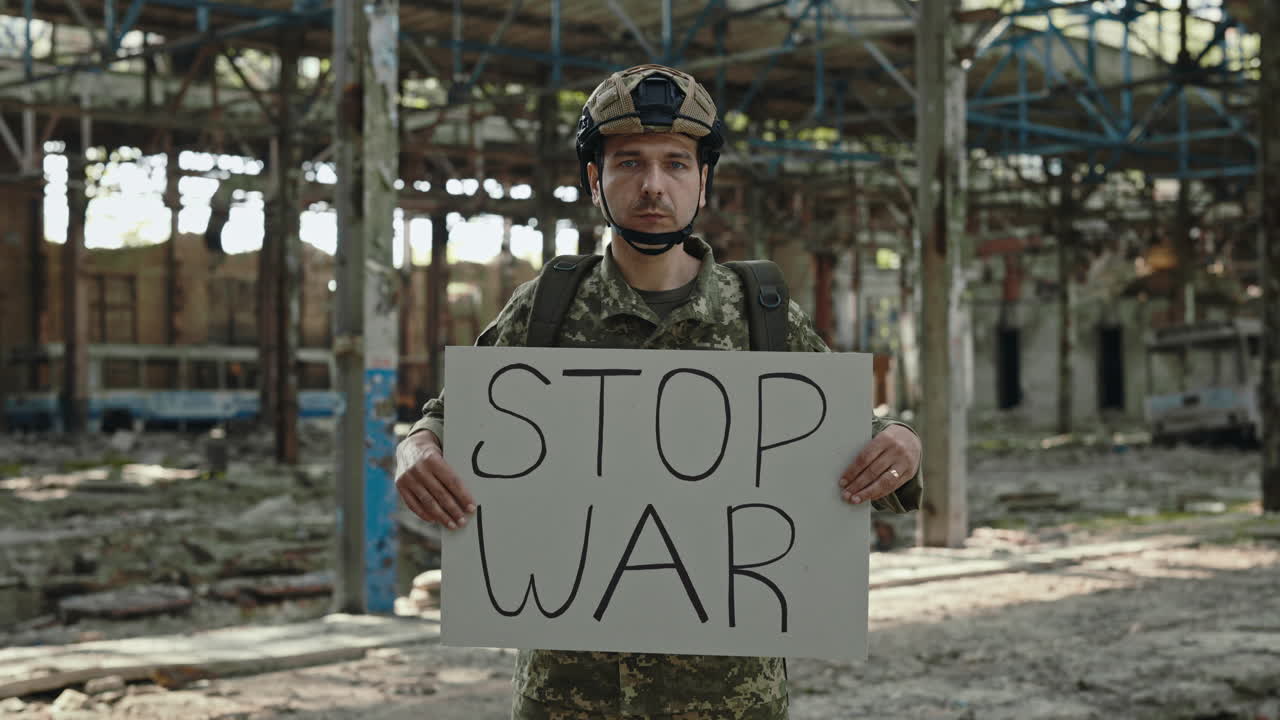 Soldier protesting war in destroyed factory