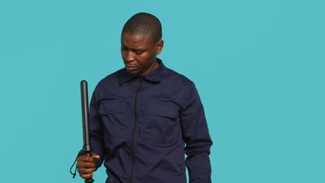 Portrait-of-bodyguard-pointing-finger-towards-truncheon