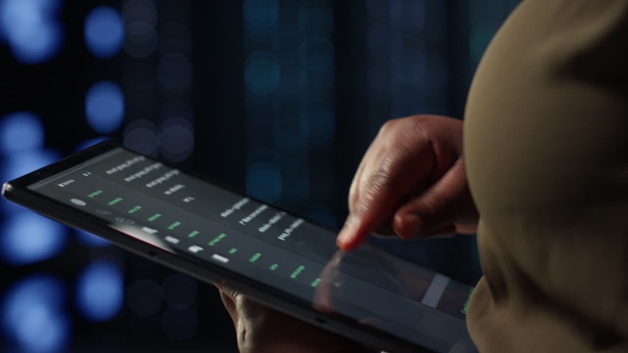 Admin in high tech data center using tablet to deploy new server architecture