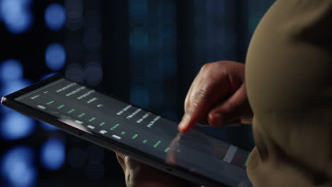 admin in high tech data center using tablet to deploy new server architecture