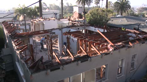 time lapse of crews demolishing a house