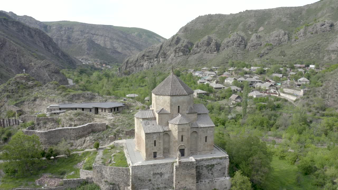 Beautiful Scenery At The Ancient Ateni Sioni Church And Tana Valley Near Gori, Shida Kartli, Georgia Surrounded In Mountain Landscape. - aerial orbit shot