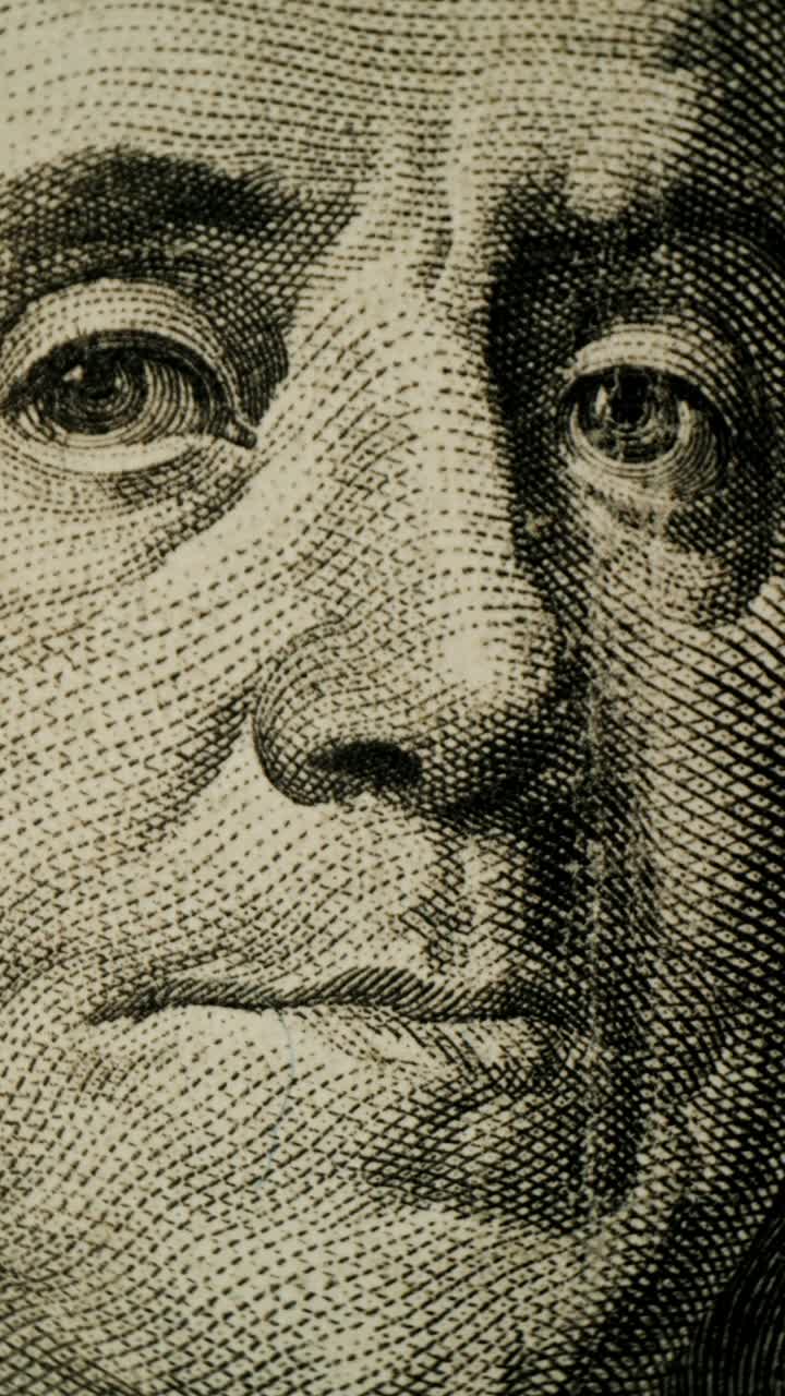 Nærbillede af George Washingtons portræt på en amerikansk 100-dollarseddel
