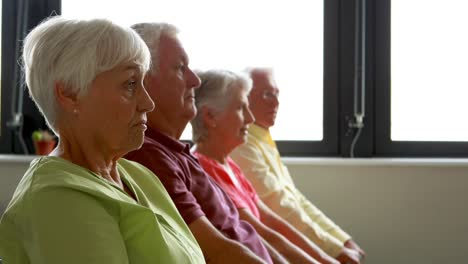 senior citizens exercising with dumbbells