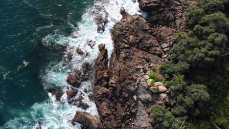 Top-Down-Drone-View-Along-Coast-of-Hiriketiya-Beach-in-Sri-Lanka