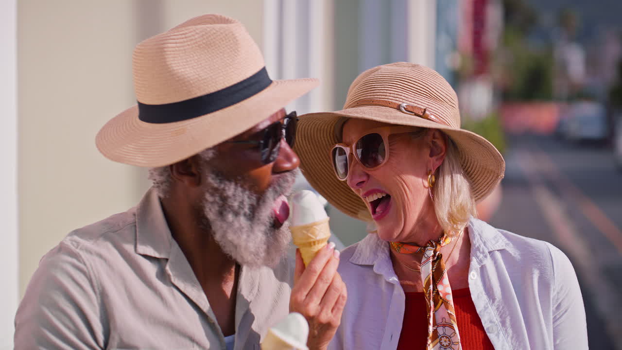 Senior couple enjoying ice cream on a sunny day