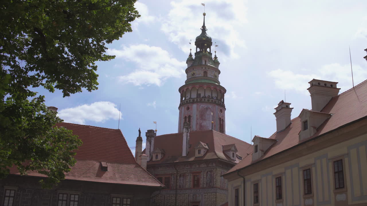 Castle tower, square with fountain in Cesky Krumlov, Czech Republic