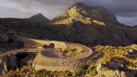 mallorca serra de tramuntana sa calobra while - sunrise in the mountains - serpentine road in golden light - calm morning in 4k