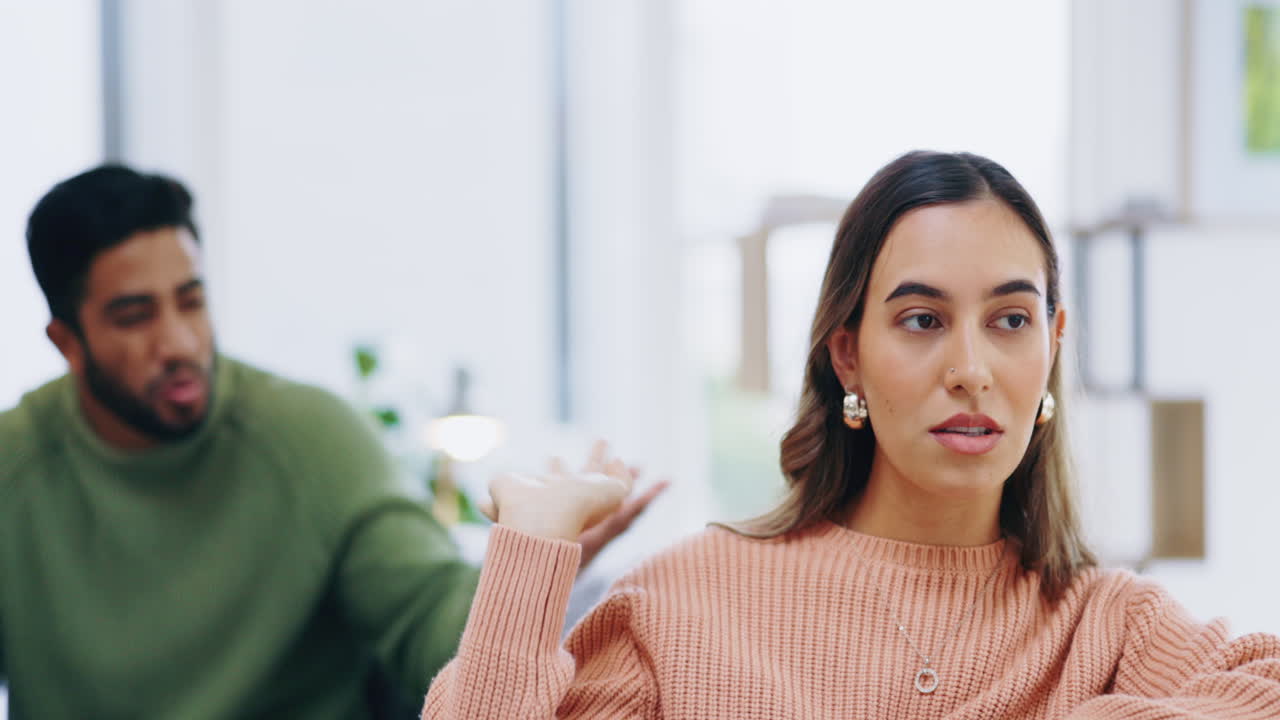 Couple, argument and talking on sofa