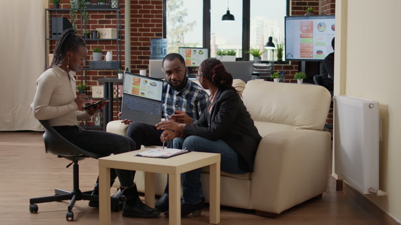 Company employees doing teamwork to create data charts