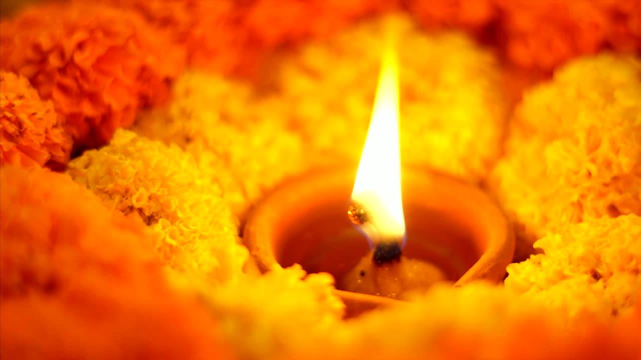 Diwali festival - closeup shot of decoration with diya and marigold flowers