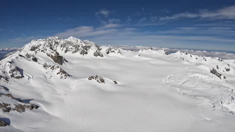 aerial shot of snow covered mountains stretching for miles, southern alps new zealand
