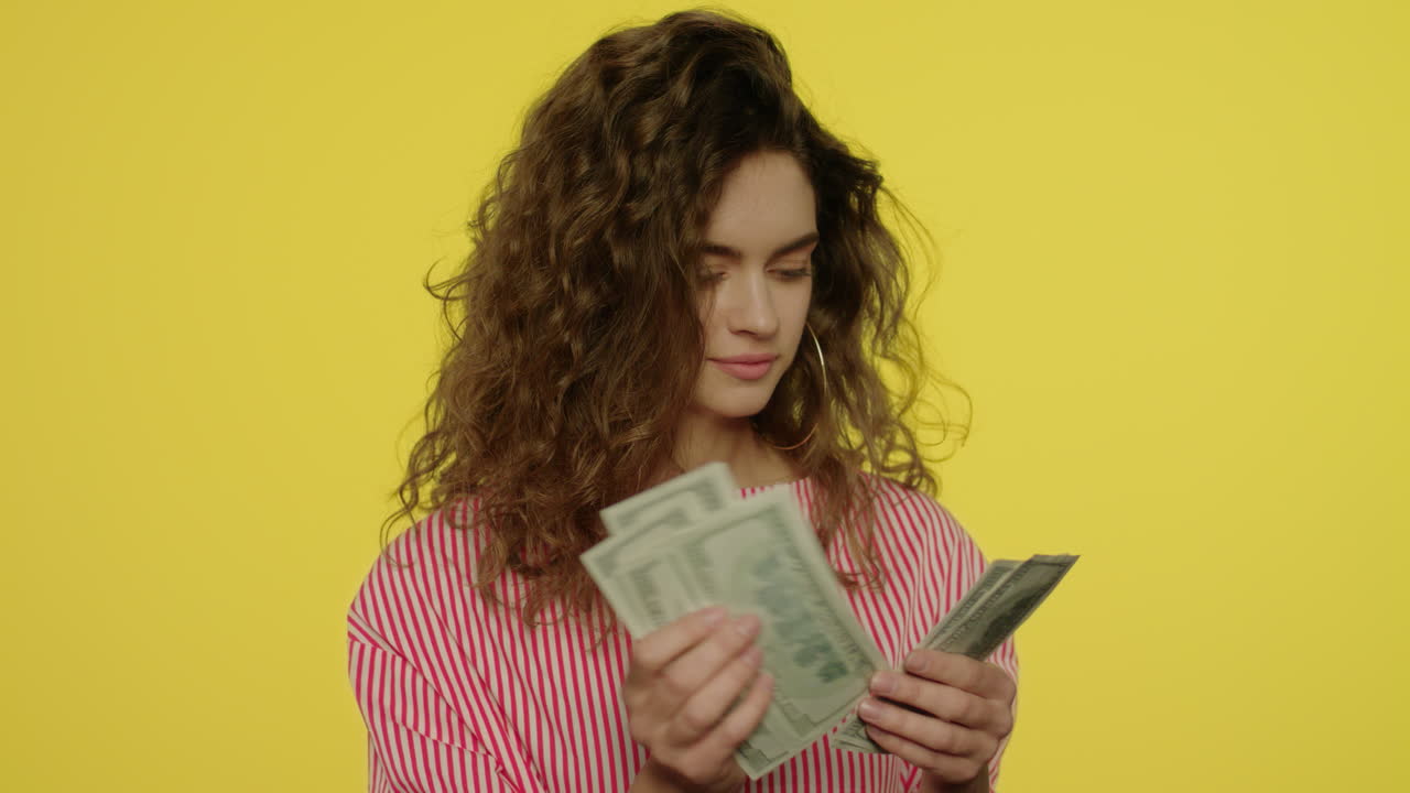 Happy woman counting cash money