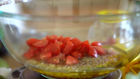 adding fresh, chopped tomatoes to the homemade olive oil, vinegar, and shallot salad dressing - antipasto series