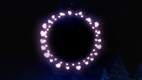 pink glowing decorative heart shaped fairy lights against shining blue stars in night sky
