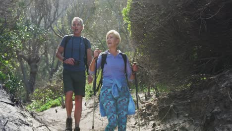 Senior-hiking-couple-with-bag-packs