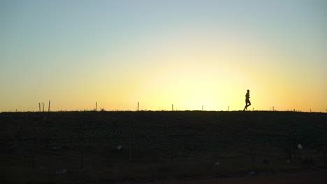 the shape of an ethiopian runner during his training session, addis ababa, ethiopia