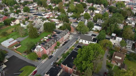 descending aerial on section of row homes in urban city in united states