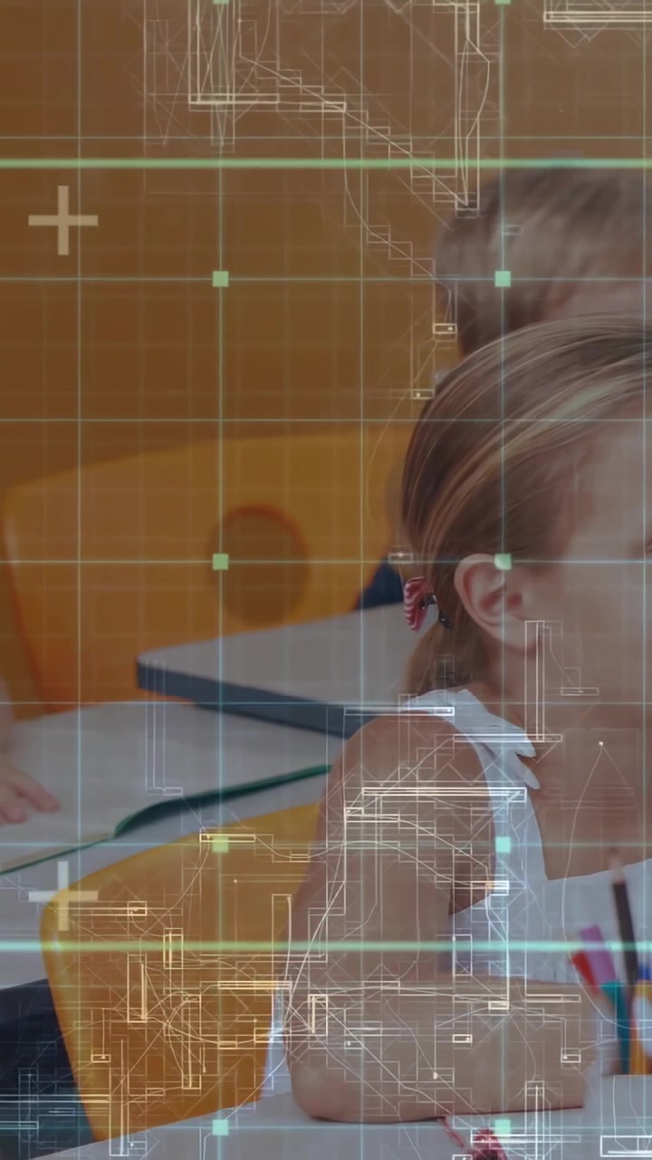 Vertical video: Camera panning right showing students writing, grid overlay on desks for education