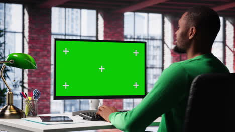 man at home using mockup on pc preparing presentation slides