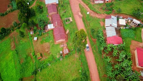 Bird's-Eye-View-Over-Tourist-Vehicle-On-Safari-Trip-In-Uganda,-East-Africa---drone-shot