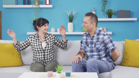 a man puts a ring on his wife's finger.