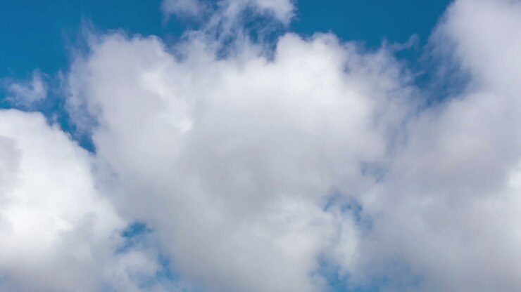 Time lapse of moving clouds in blue sky