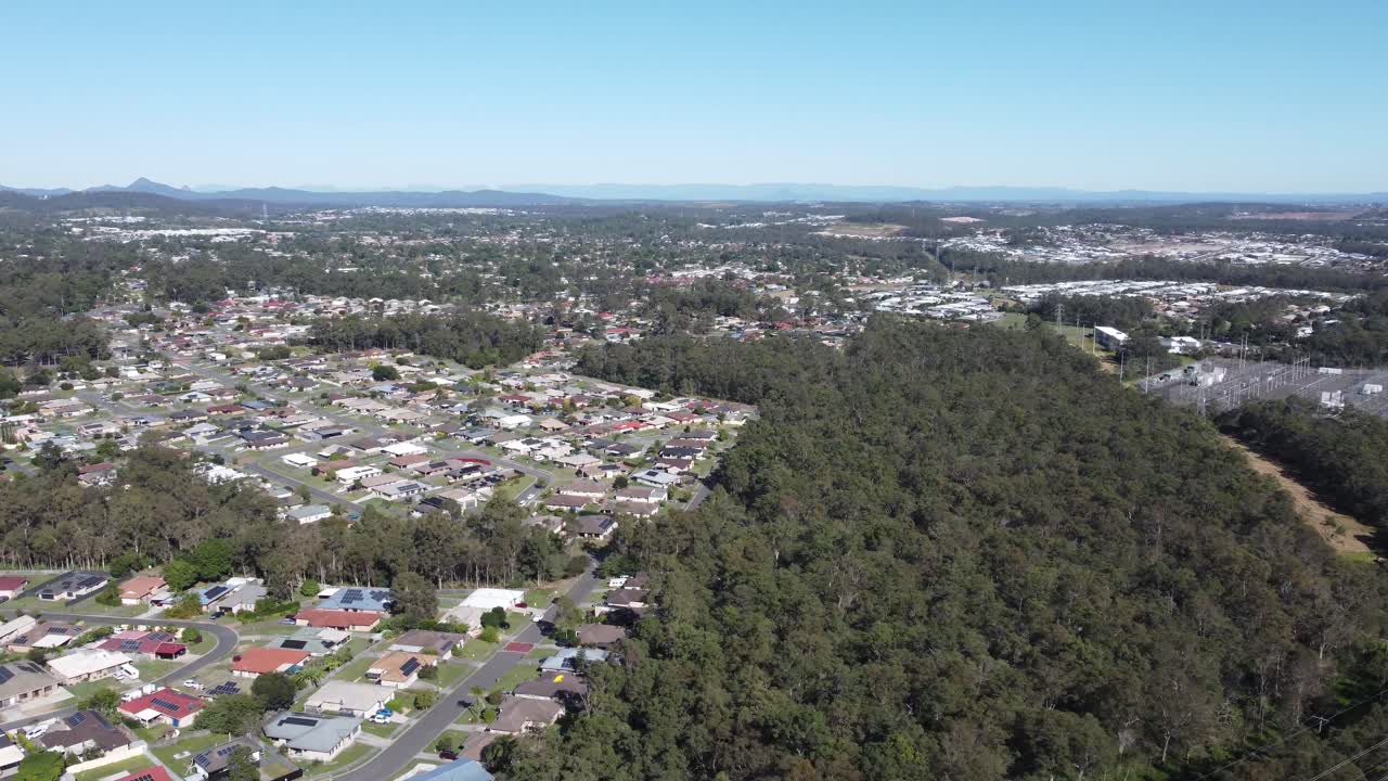 4K Aerial view of a suburb near bushland in Australia