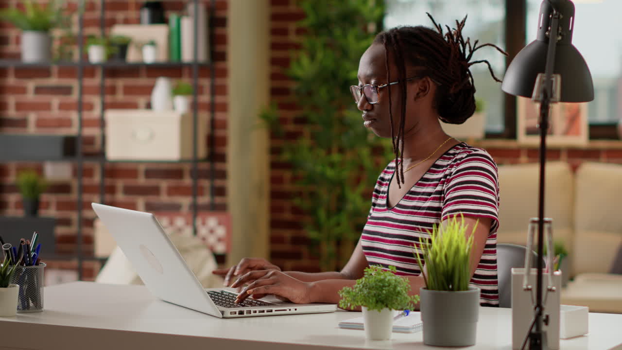 Woman working on laptop at home