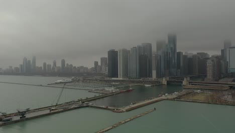 Chicago,-IL-with-fog-and-light-snow-drone-going-up