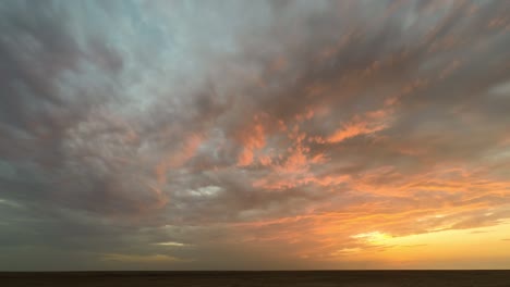 time lapse during sunset in the little rann of kutch a flat landscape and amazing cloud movement in gujarat indiarann of kutch, dusk light seen reflecting on the clouds