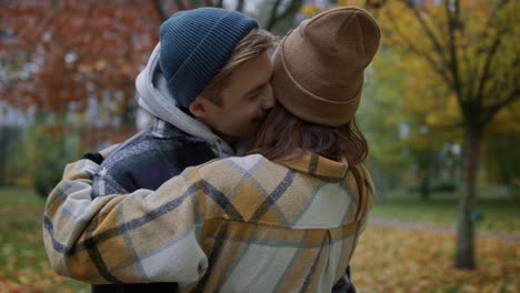 happy lovely couple hugging outdoors