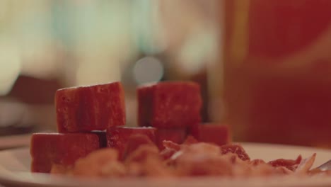 close-up of stacked traditional brown sugar cubes on a plate – authentic thai dessert ingredient.