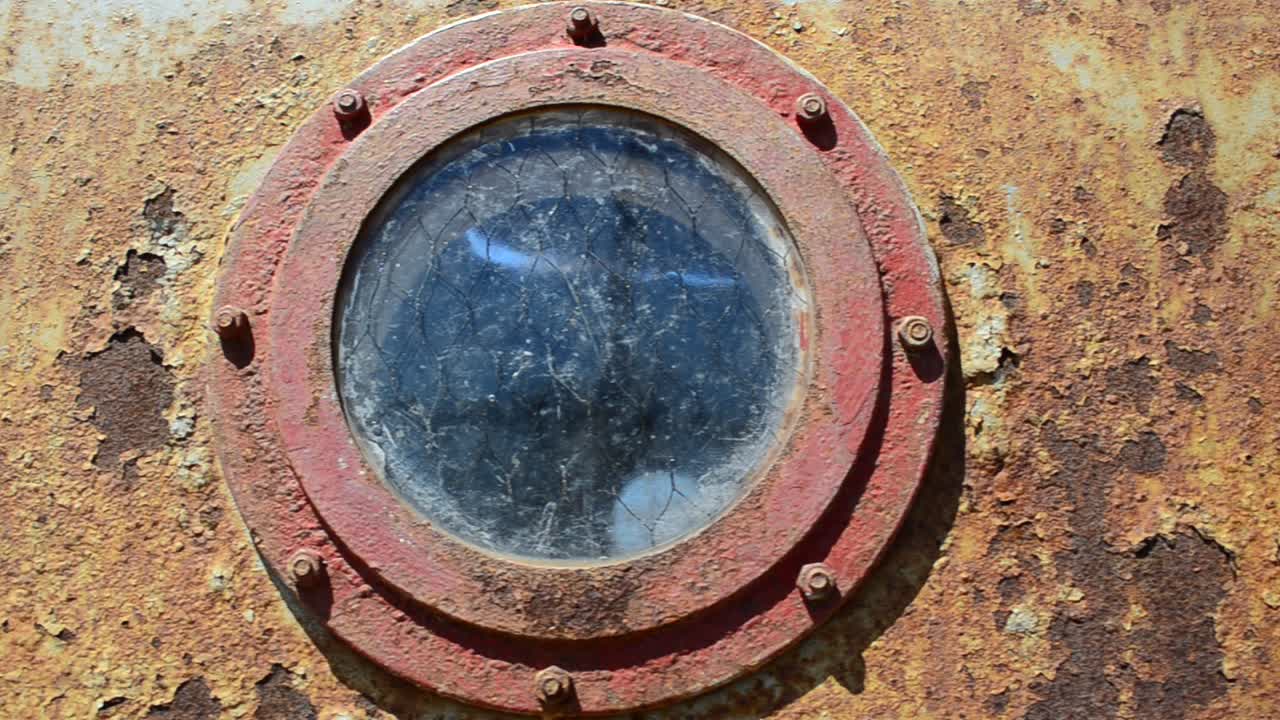 Very rusty old ship, dump. Windows in the rusty ship