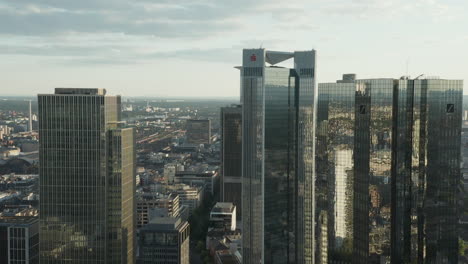 AERIAL:-Breathtaking-View-of-Frankfurt-am-Main-Skyline-reflecting-in-Summer-Sunlight-in-June-2020