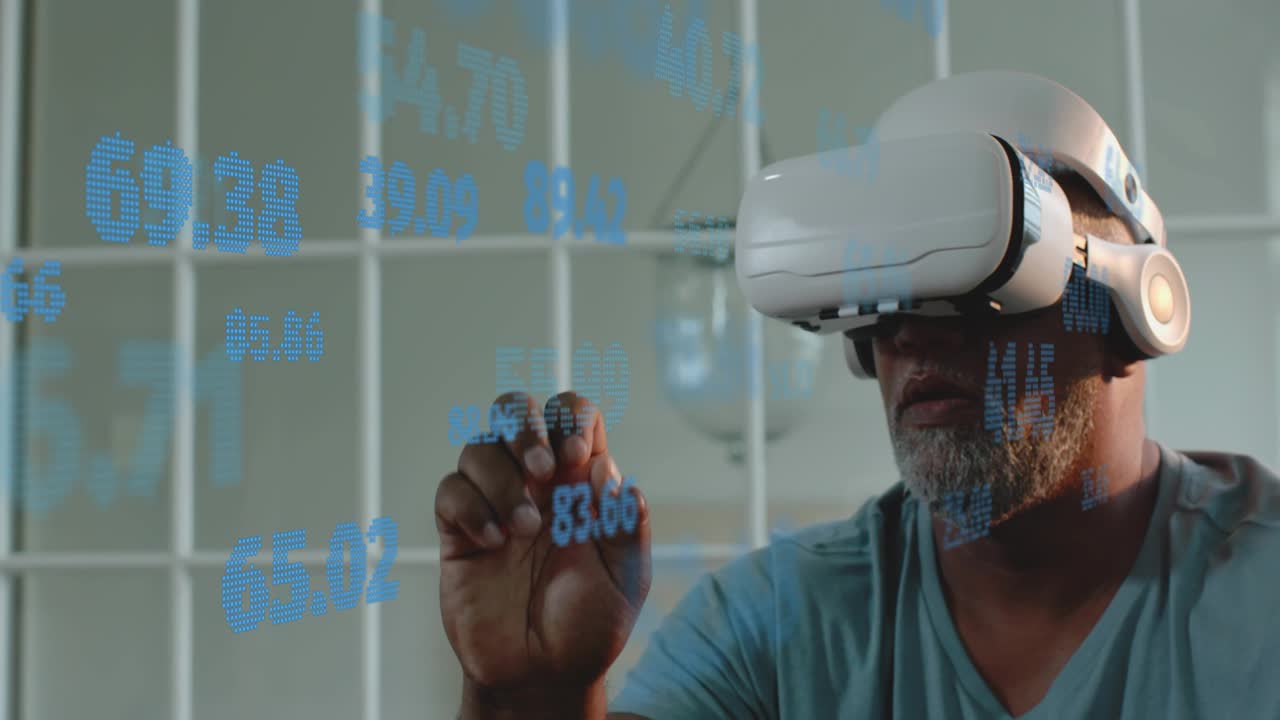 Senior man in white VR headset reaching right hand, pinching blue holograms and analyzing data